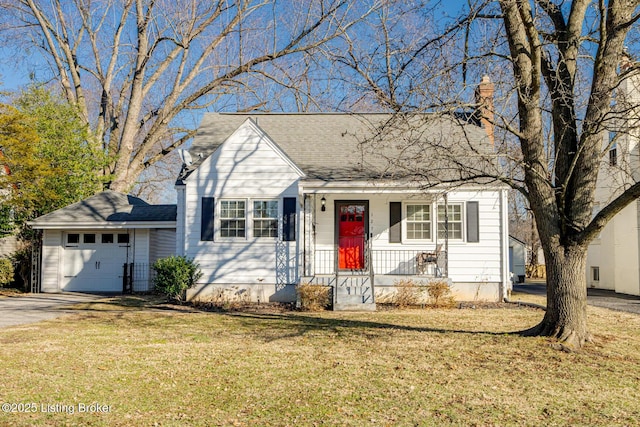 view of front of property with a garage and a front yard