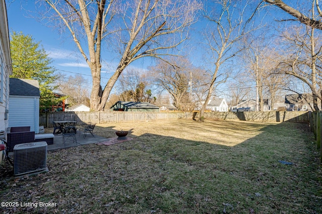 view of yard featuring central air condition unit and a patio area