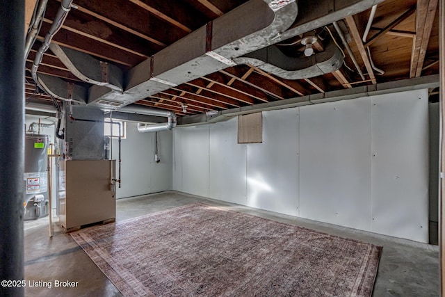 basement with heating unit and water heater