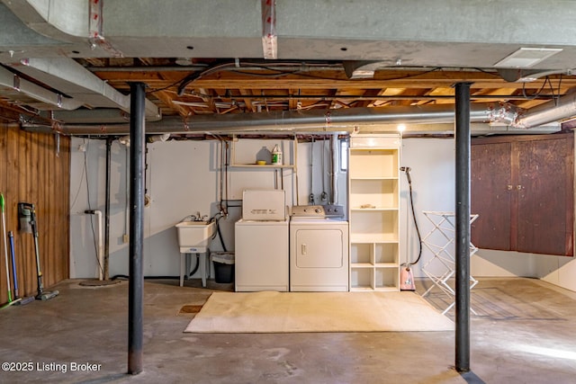 basement with sink and independent washer and dryer