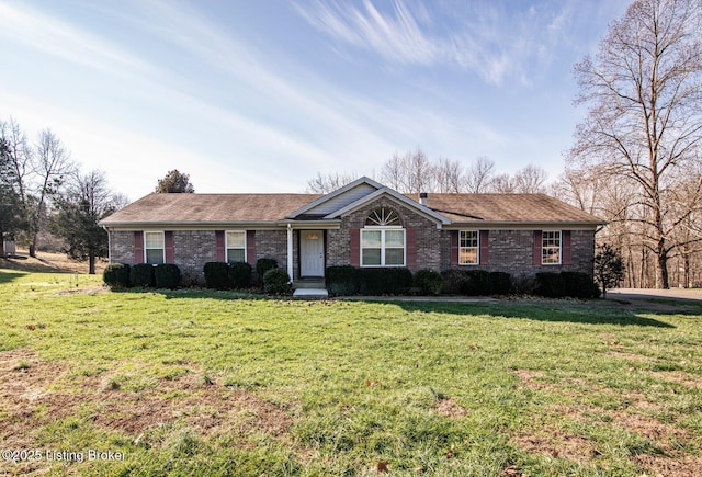 ranch-style home with a front lawn