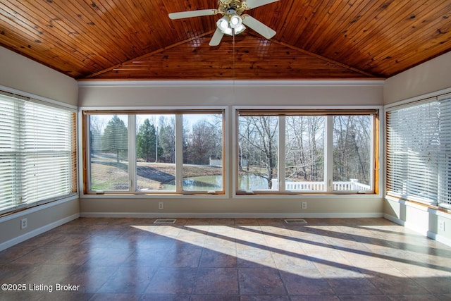 unfurnished sunroom featuring ceiling fan, vaulted ceiling, and wooden ceiling