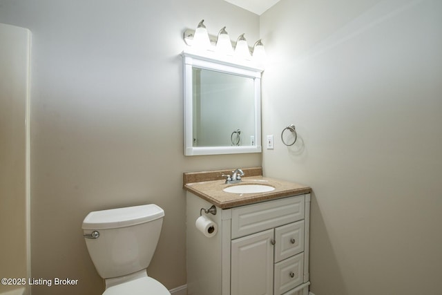 bathroom with toilet and vanity