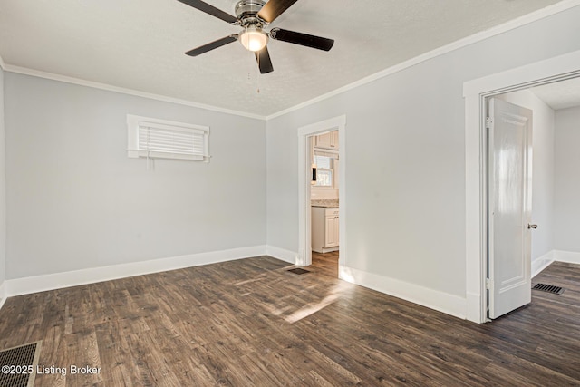 unfurnished room with a textured ceiling, ceiling fan, ornamental molding, and dark hardwood / wood-style floors