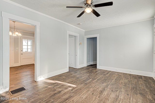 unfurnished room with a textured ceiling, crown molding, ceiling fan with notable chandelier, and dark hardwood / wood-style floors