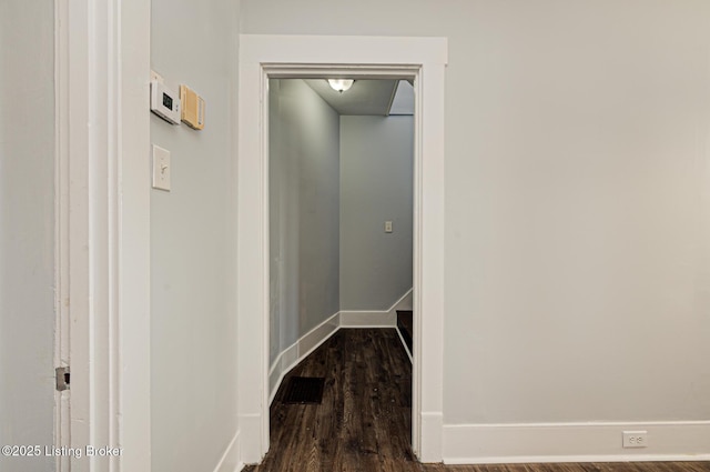 hallway featuring dark wood-type flooring