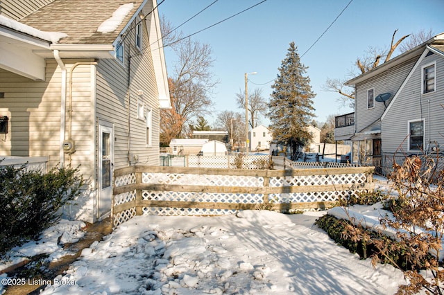 view of yard layered in snow