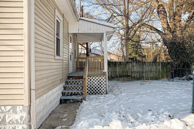 view of yard layered in snow