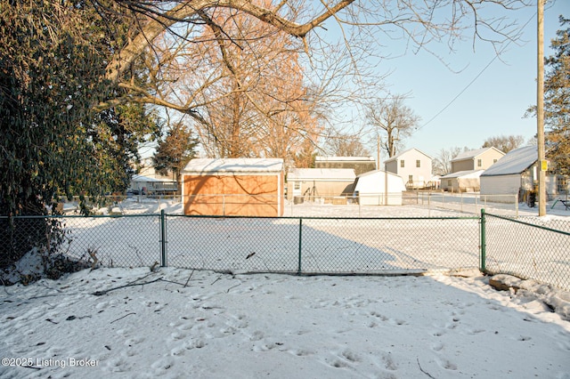 view of yard layered in snow