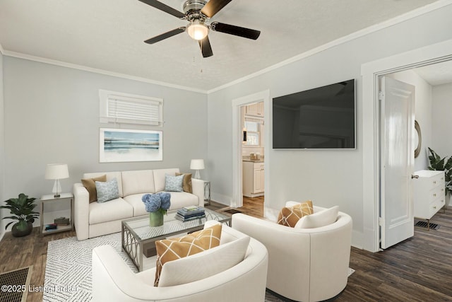 living room with ceiling fan, dark wood-type flooring, and crown molding