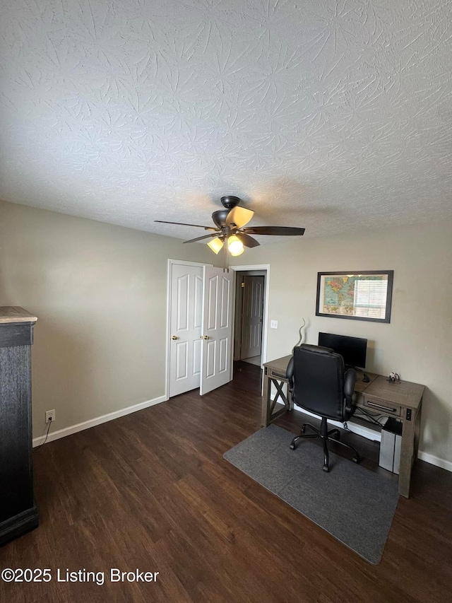 office area featuring ceiling fan, dark hardwood / wood-style flooring, and a textured ceiling