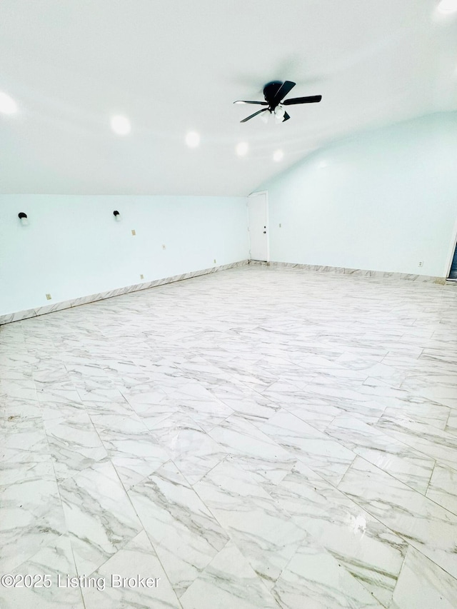 unfurnished room featuring lofted ceiling and ceiling fan