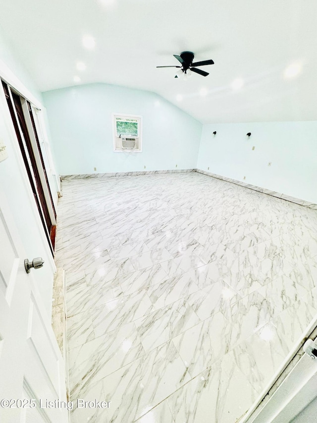 interior space with vaulted ceiling, ceiling fan, and cooling unit