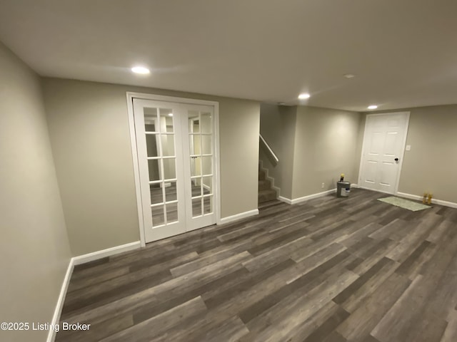 basement with dark hardwood / wood-style flooring