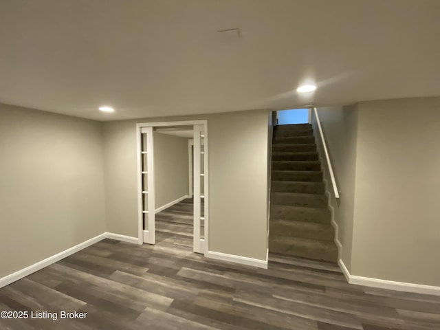 basement featuring dark hardwood / wood-style flooring