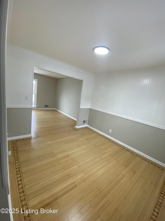 empty room with light wood-type flooring