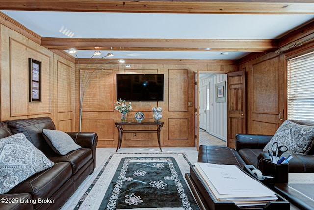 living room featuring wooden walls and beam ceiling