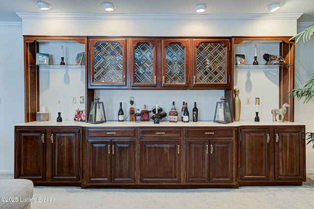 bar featuring light carpet and dark brown cabinetry