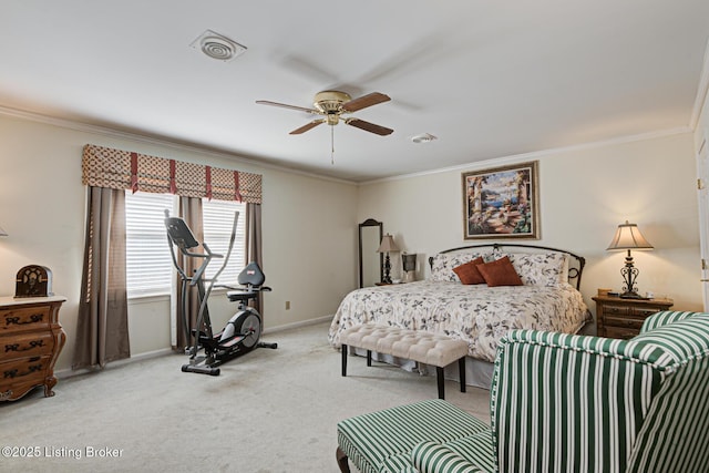 carpeted bedroom with ornamental molding and ceiling fan