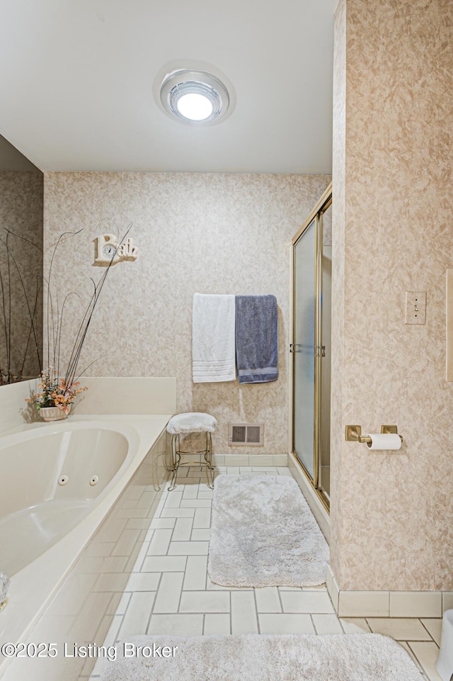 bathroom featuring tile patterned flooring and plus walk in shower