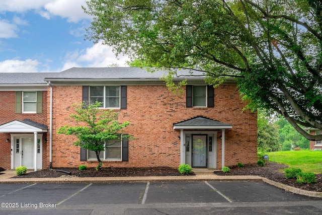 161 Gardiner Lake Rd Unit 161, Louisville, KY 40205 - view of front of property with uncovered parking, brick siding, and a shingled roof