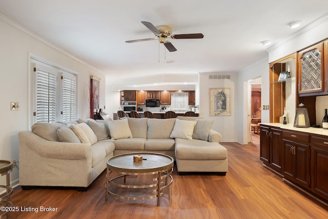 161 Gardiner Lake Rd Unit 161, Louisville, KY 40205 - living area with ceiling fan, wood finished floors, crown molding, and baseboards