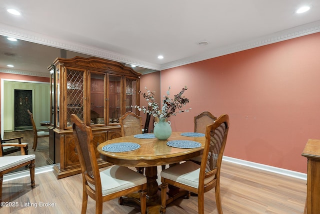 161 Gardiner Lake Rd Unit 161, Louisville, KY 40205 - dining room featuring light wood-style floors, baseboards, recessed lighting, crown molding, and bar with sink