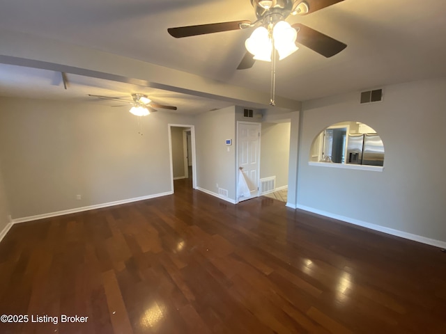 unfurnished room with ceiling fan and dark wood-type flooring