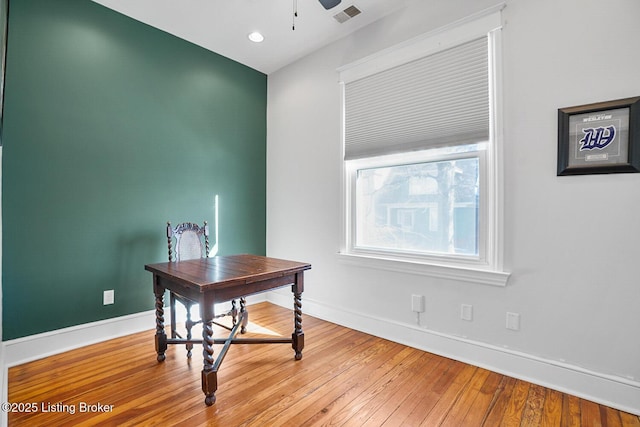 office area with hardwood / wood-style floors and ceiling fan