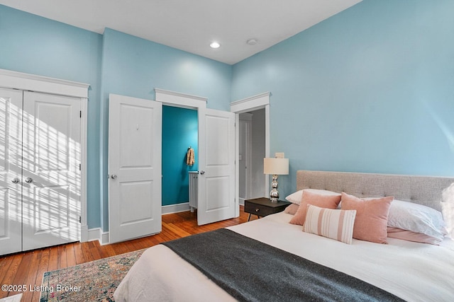 bedroom with hardwood / wood-style floors