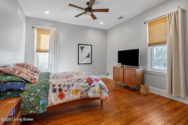 bedroom featuring ceiling fan and hardwood / wood-style floors