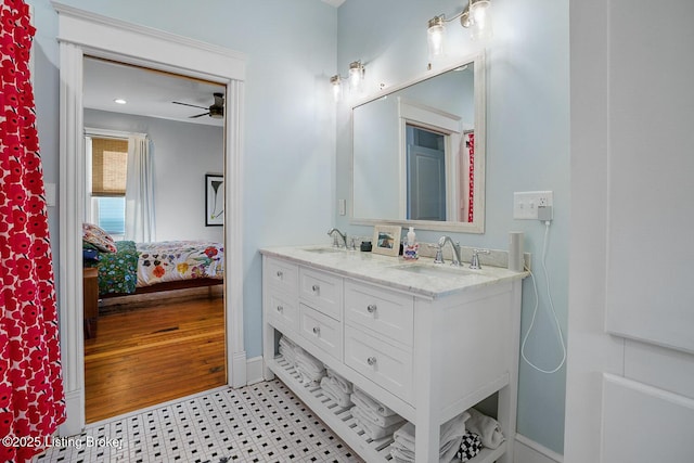 bathroom with ceiling fan and vanity