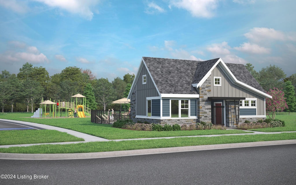 view of front of property featuring a front yard and a playground