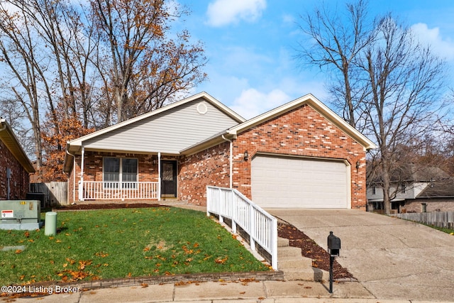 view of front facade with covered porch, a garage, and a front lawn