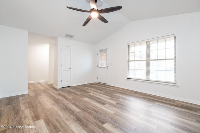 spare room with light hardwood / wood-style flooring, ceiling fan, and lofted ceiling