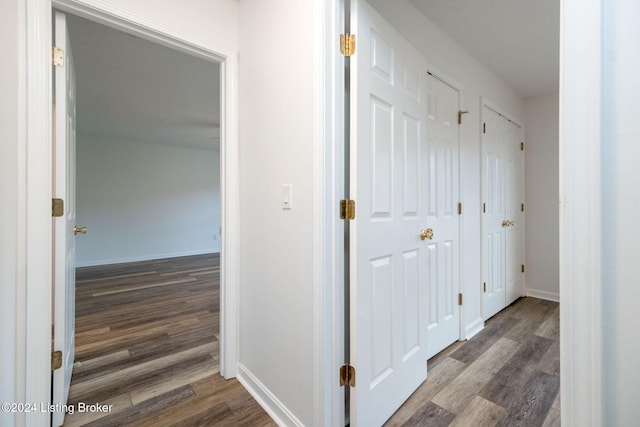 hall with dark wood-type flooring