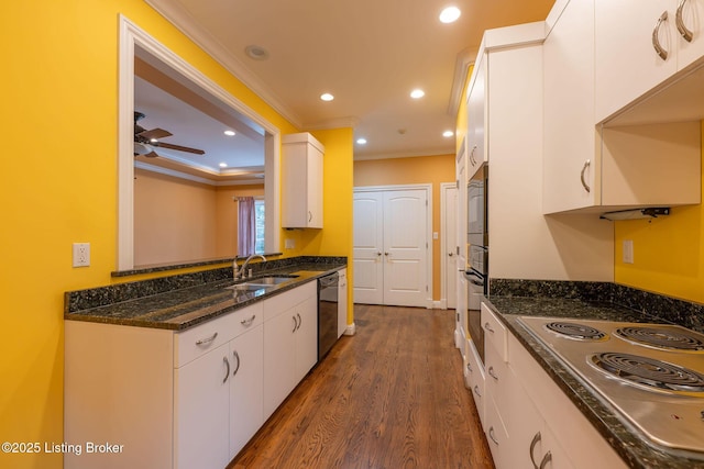 kitchen with crown molding, cooktop, dishwasher, and white cabinets