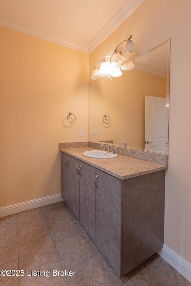 bathroom with ornamental molding and vanity