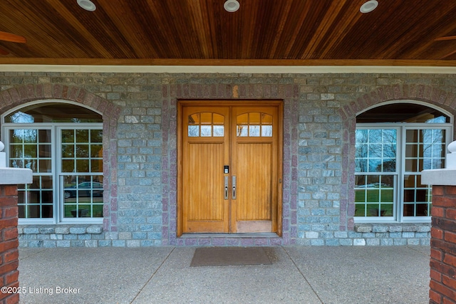 view of exterior entry featuring a porch