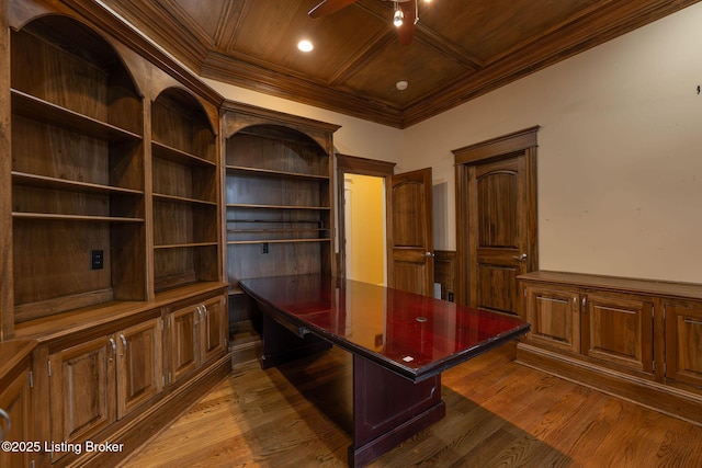 unfurnished office with dark wood-type flooring, coffered ceiling, crown molding, wooden ceiling, and ceiling fan