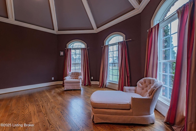 unfurnished room featuring hardwood / wood-style flooring, crown molding, high vaulted ceiling, and beam ceiling