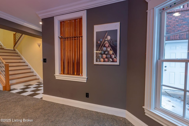 carpeted empty room featuring ornamental molding