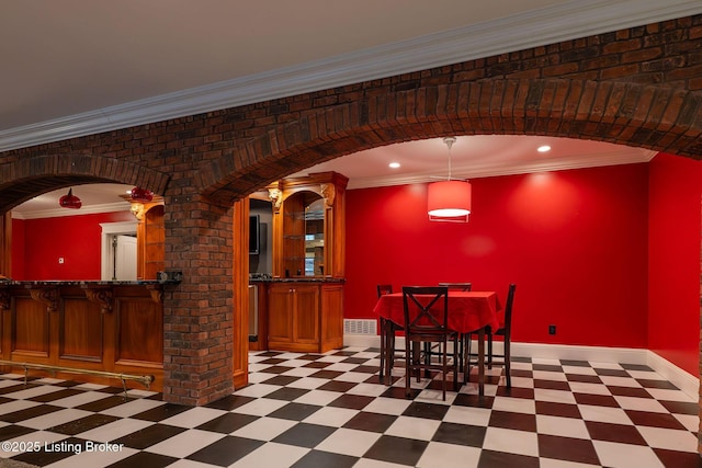 unfurnished dining area with crown molding