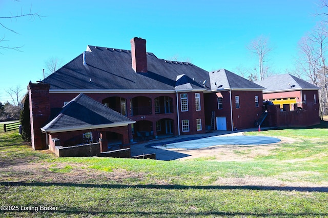 2713 Mayo Ln, Prospect, KY 40059 - back of house featuring a patio, a lawn, and a chimney