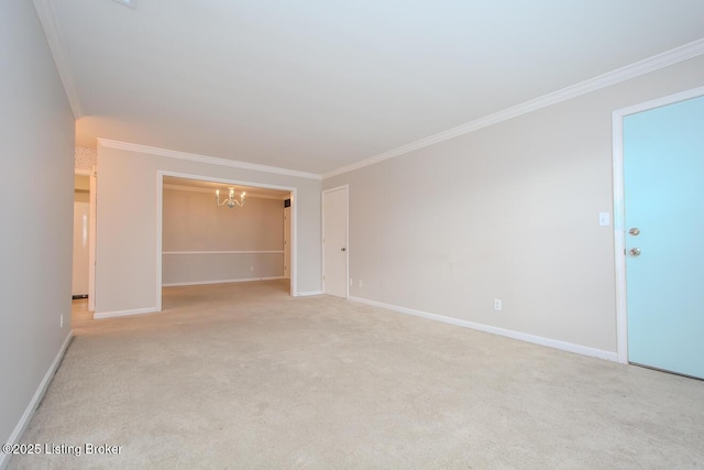 carpeted spare room featuring a chandelier and ornamental molding