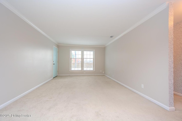 carpeted spare room with crown molding