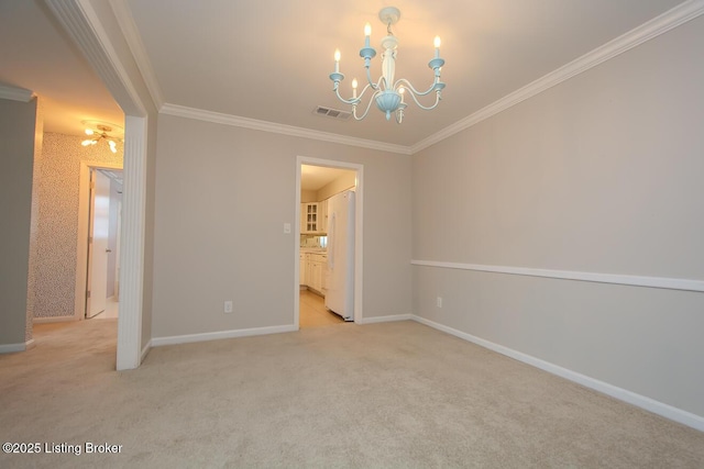 carpeted spare room with crown molding and a chandelier