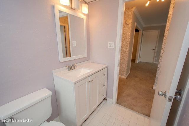 bathroom featuring tile patterned flooring, toilet, vanity, and ornamental molding