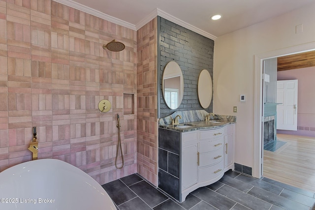 bathroom with ornamental molding, plus walk in shower, and vanity