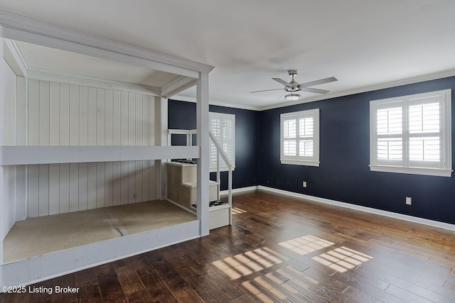 unfurnished living room with ceiling fan, crown molding, and hardwood / wood-style floors